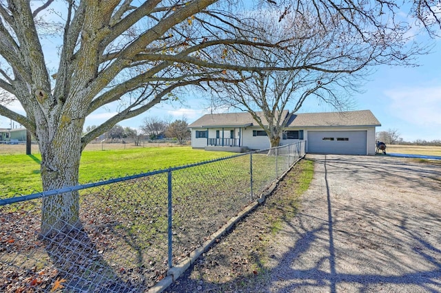 ranch-style home featuring a garage and a front lawn