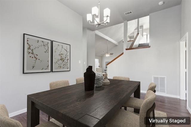 dining space featuring ceiling fan with notable chandelier, high vaulted ceiling, and dark hardwood / wood-style flooring