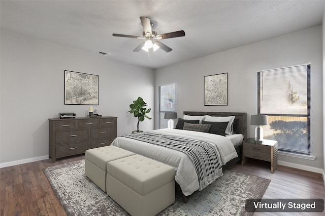 bedroom with ceiling fan and wood-type flooring