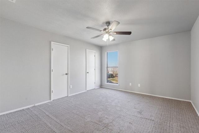 unfurnished bedroom featuring carpet floors and ceiling fan