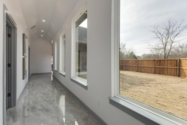 hall with vaulted ceiling