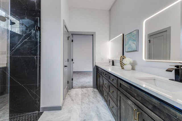 bathroom with walk in shower and vanity