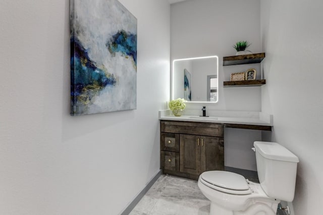 bathroom with toilet and vanity