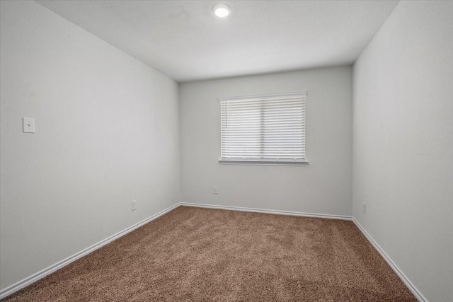 unfurnished room featuring carpet