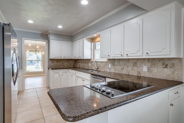 kitchen with kitchen peninsula, stainless steel appliances, white cabinetry, light tile patterned flooring, and sink