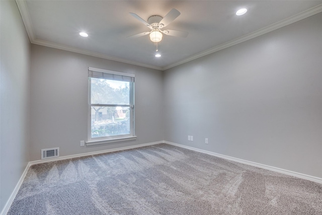 empty room featuring ornamental molding, ceiling fan, and carpet floors