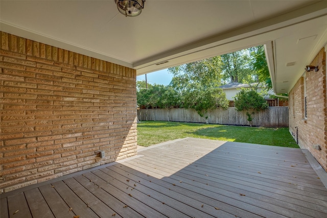 deck featuring a lawn