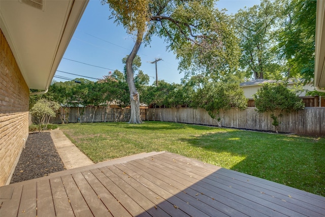 wooden terrace featuring a yard