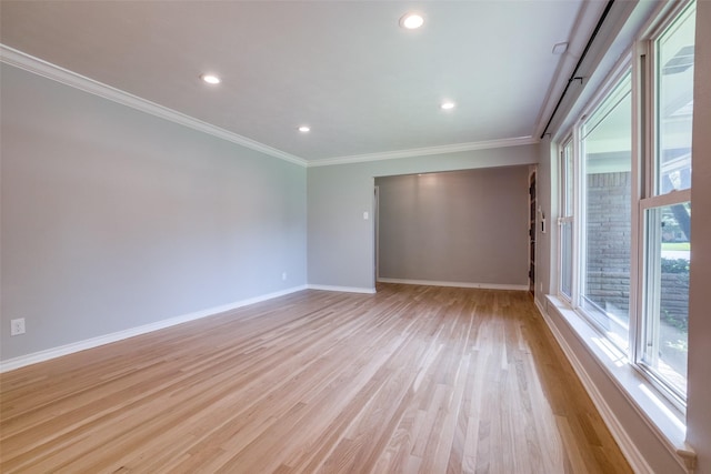 unfurnished room with ornamental molding, light hardwood / wood-style floors, and a wealth of natural light