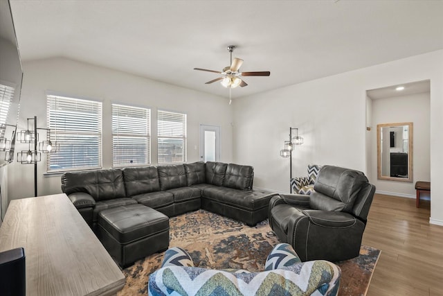 living room with vaulted ceiling, ceiling fan, and hardwood / wood-style floors