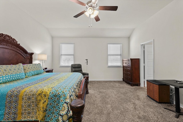 carpeted bedroom with ceiling fan and vaulted ceiling