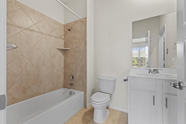 full bathroom featuring tiled shower / bath combo, vanity, toilet, and tile patterned flooring