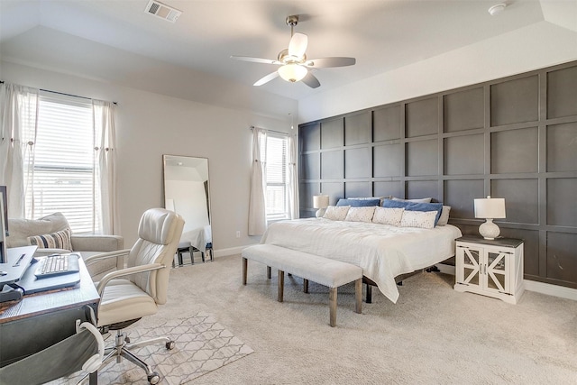 bedroom featuring ceiling fan and light carpet