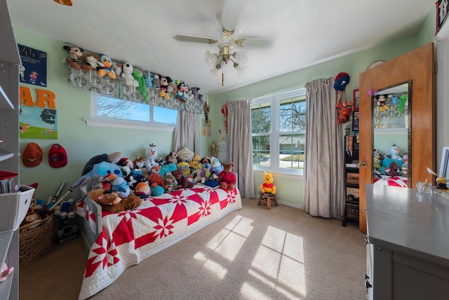 bedroom featuring ceiling fan and light carpet