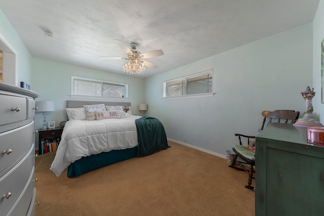 bedroom featuring ceiling fan and light colored carpet