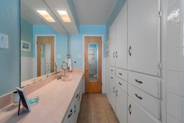 bathroom with tile patterned flooring and sink