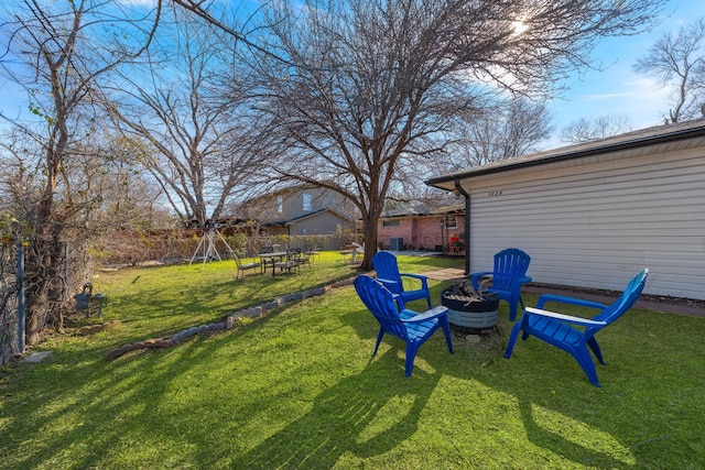 view of yard with a fire pit