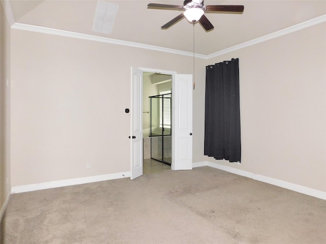 carpeted empty room featuring ceiling fan and crown molding