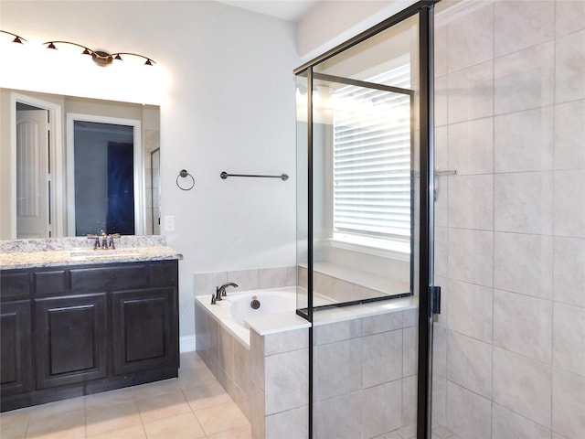 bathroom with vanity, tile patterned floors, and independent shower and bath