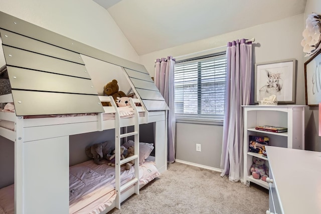 bedroom with lofted ceiling and light colored carpet