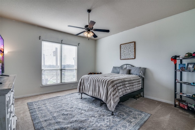 bedroom with ceiling fan and carpet