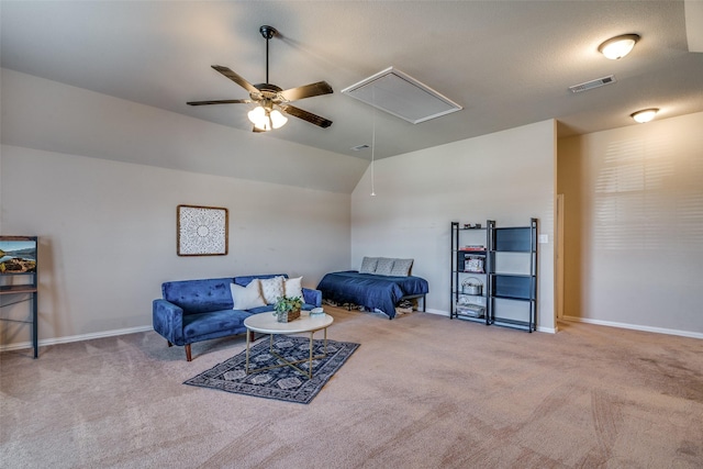 carpeted living room featuring ceiling fan and lofted ceiling