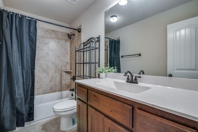 full bathroom featuring tile patterned floors, shower / bath combo with shower curtain, vanity, and toilet