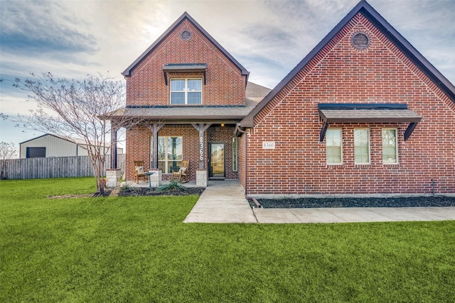 back of property with a patio and a lawn