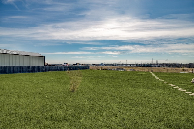 view of yard with a rural view