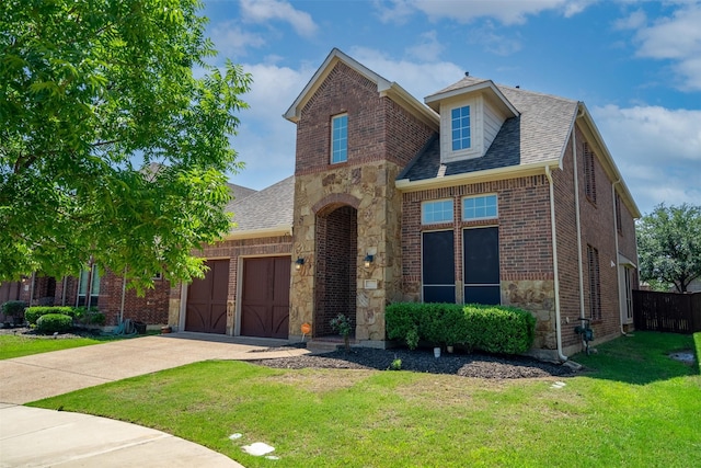 view of front facade with a front lawn and a garage