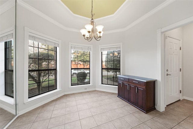 unfurnished dining area with a notable chandelier, light tile patterned flooring, a raised ceiling, and plenty of natural light