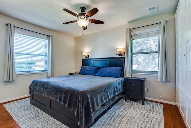 bedroom featuring hardwood / wood-style flooring and ceiling fan