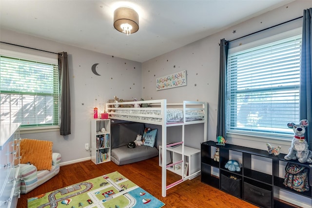 bedroom with hardwood / wood-style floors