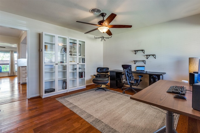 office area with ceiling fan and dark hardwood / wood-style flooring