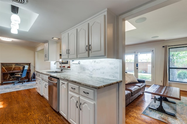 kitchen featuring dark wood-type flooring, sink, white cabinetry, stainless steel dishwasher, and light stone countertops