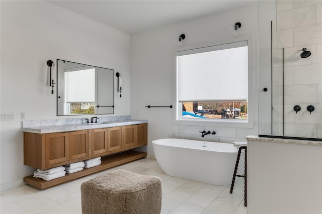 bathroom featuring shower with separate bathtub, tile patterned floors, and vanity