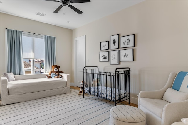 bedroom featuring ceiling fan and hardwood / wood-style floors