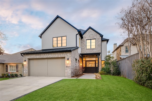 view of front facade featuring a front yard and a garage