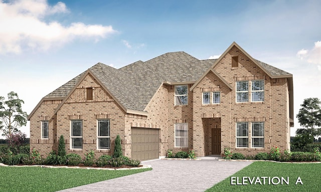 view of front of home featuring a front yard and a garage