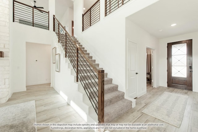 entrance foyer featuring light hardwood / wood-style floors and ceiling fan