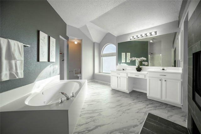 full bathroom with a textured ceiling, vaulted ceiling, vanity, and shower with separate bathtub