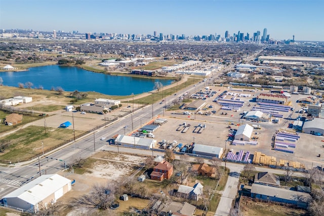 birds eye view of property with a water view and a city view