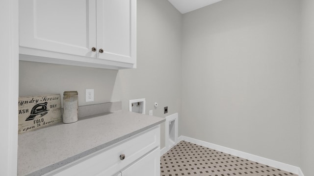 laundry area featuring cabinets, hookup for a washing machine, and hookup for an electric dryer