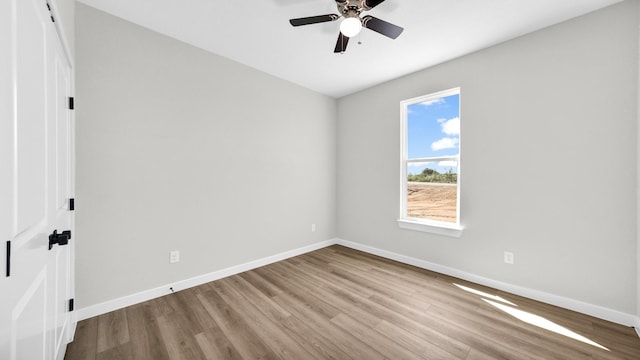 spare room with ceiling fan and light hardwood / wood-style floors