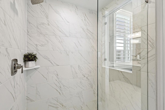 bathroom with plenty of natural light and a tile shower