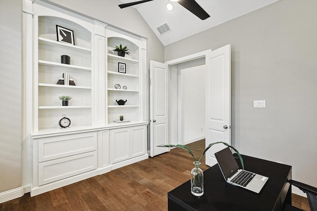 office featuring ceiling fan, dark hardwood / wood-style floors, vaulted ceiling, and built in features