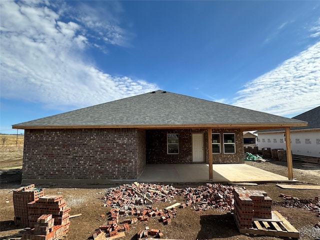 rear view of property featuring a patio area