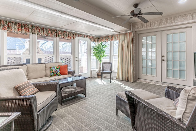 sunroom featuring french doors and ceiling fan