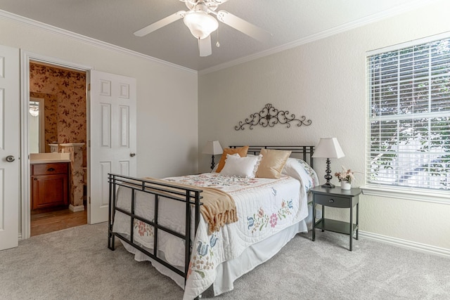 bedroom with a textured wall, ornamental molding, carpet flooring, and baseboards