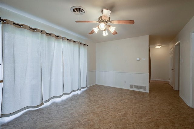 unfurnished room with ceiling fan